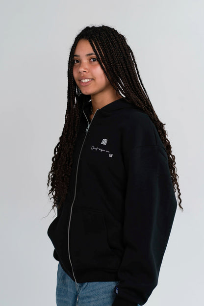 Side view of the Open Source Jesus Presence Fluff Zip in Black on a model
