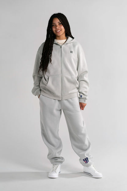 Full body: model in the Ticket Cozy Zip and Open Source Signal Cozy Pants in Light Asphalt